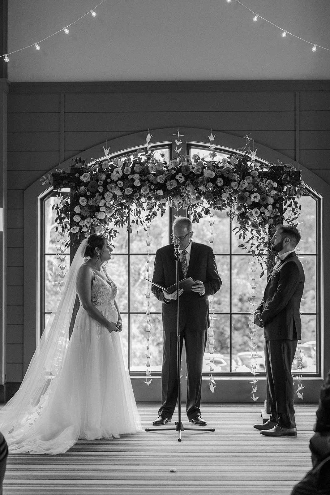 A black and white photo of a wedding ceremony