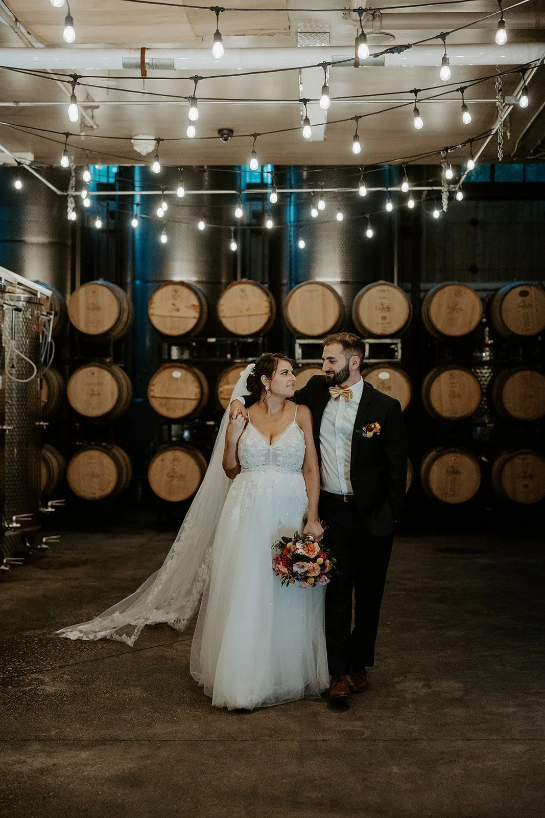 A couple taking photos at their winery new hampshire wedding venue