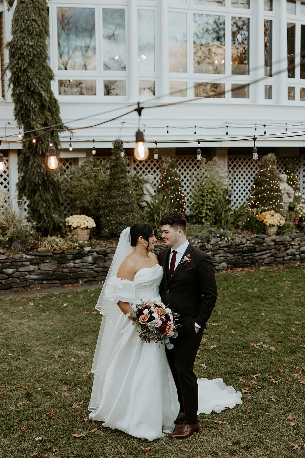 A bride and groom taking wedding photos at bedford village inn