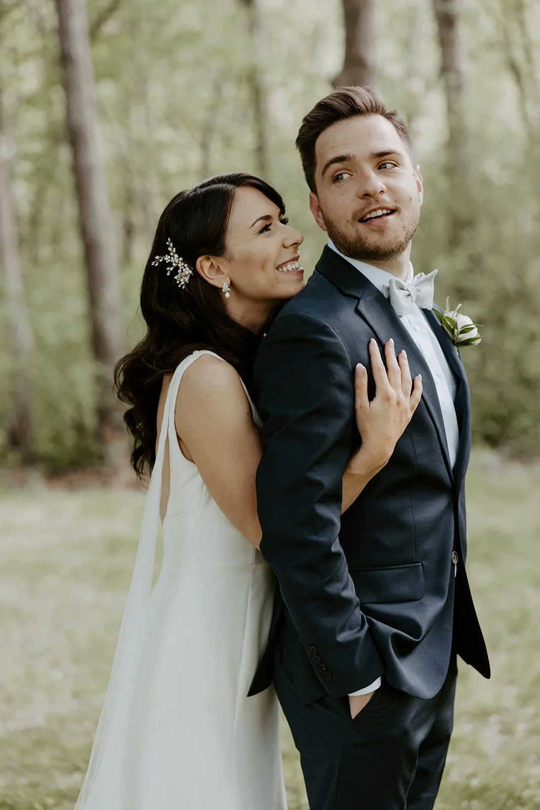 A couple posing for photos on their wedding photo list