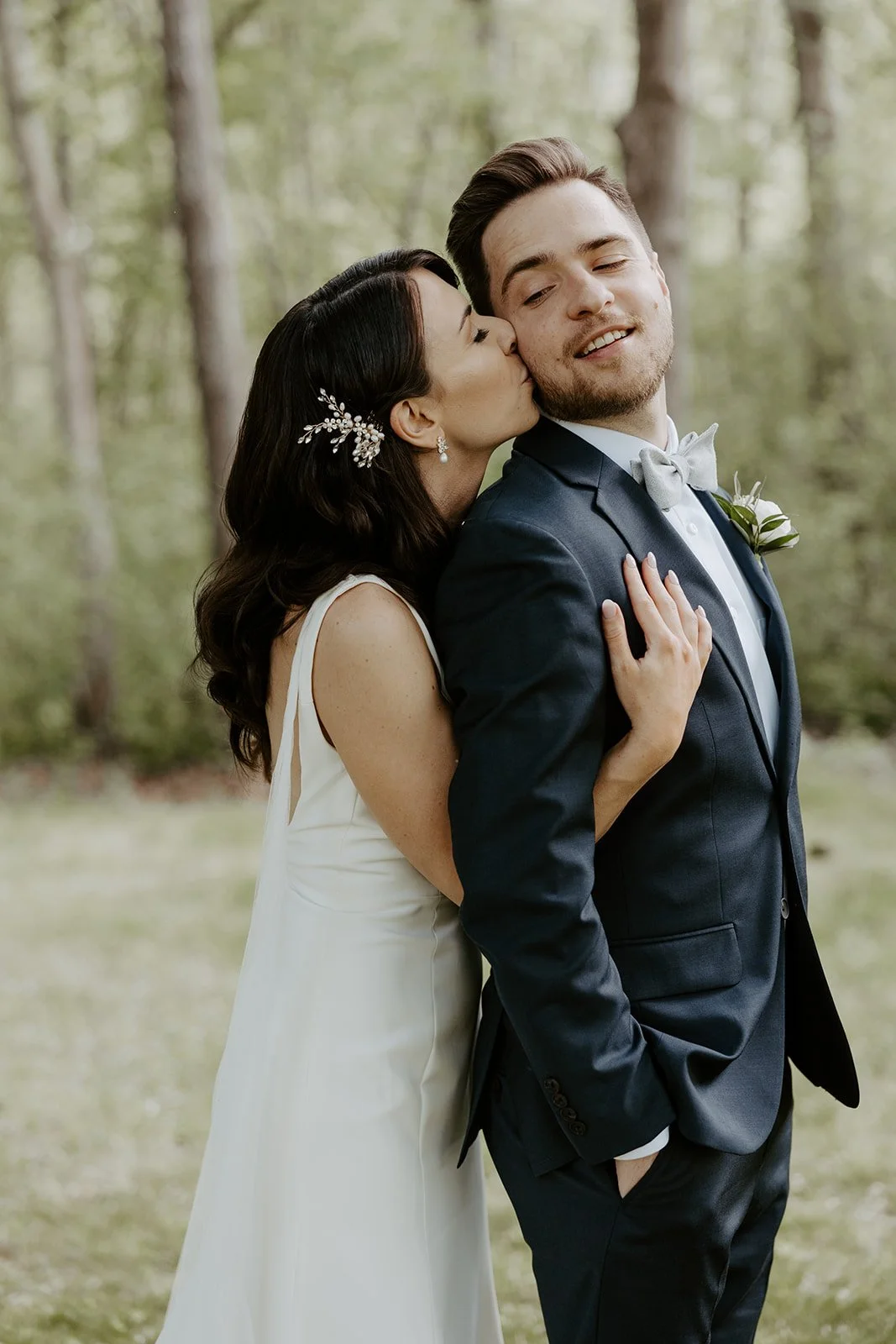 A couple posing for photos on their wedding photo list