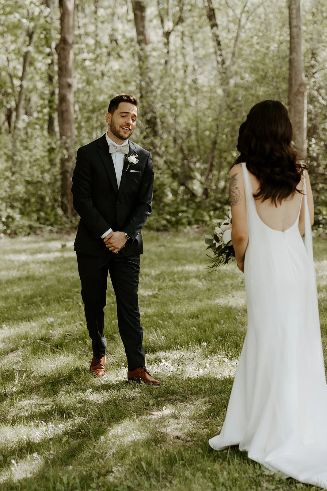 A groom's reaction to a first look with his wife