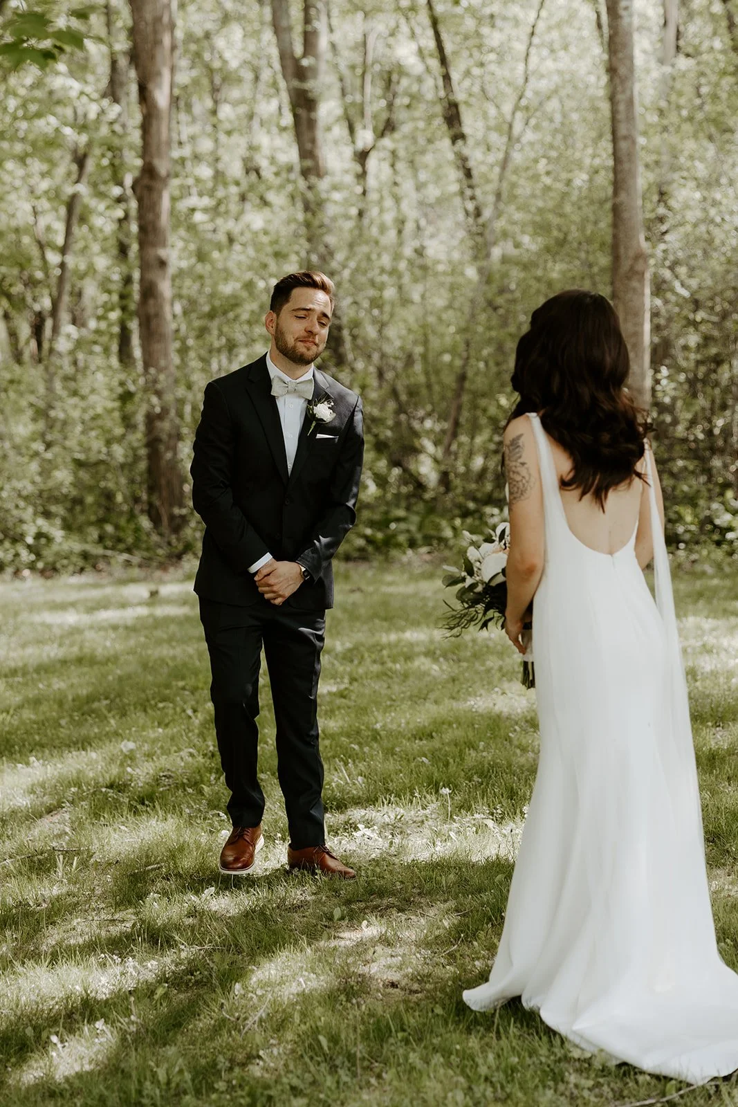 A groom's reaction to a first look with his wife