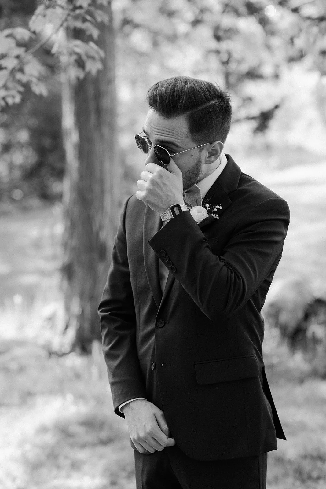 A groom crying before the first look photos on his wedding photo list