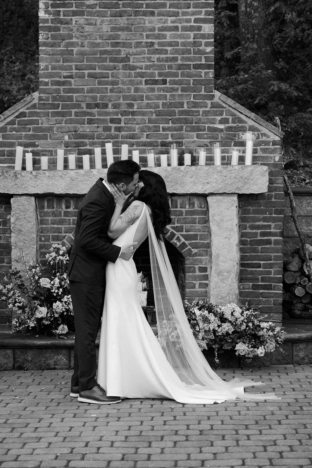 A bride and groom's first kiss photo from a wedding photo list