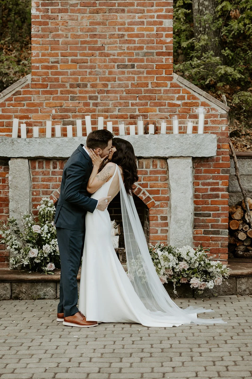 A bride and groom's first kiss photo from a wedding photo list