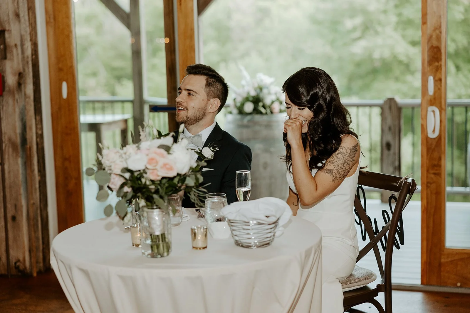Candid wedding photos of a bride and groom during toasts