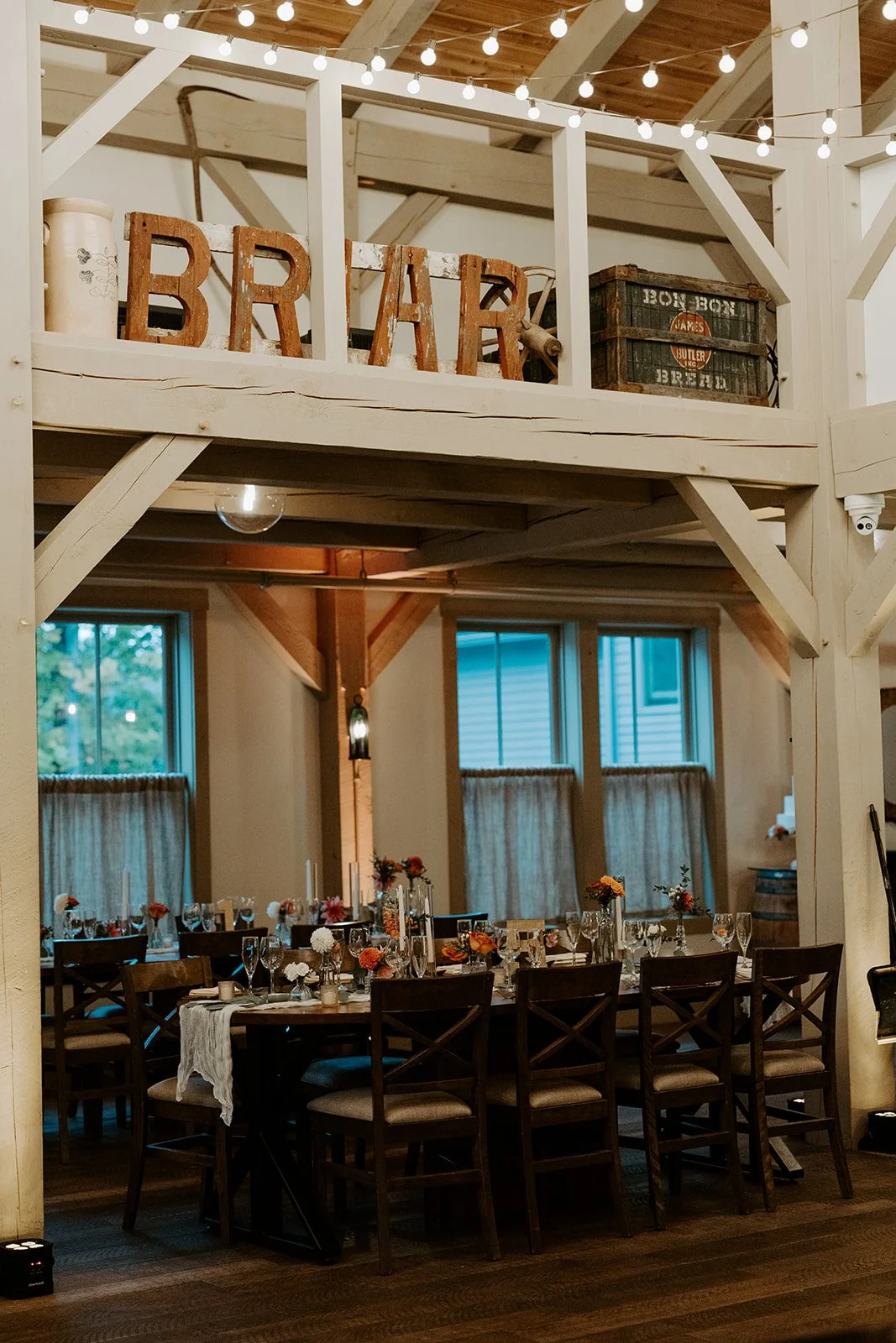 An indoor wedding reception in a barn
