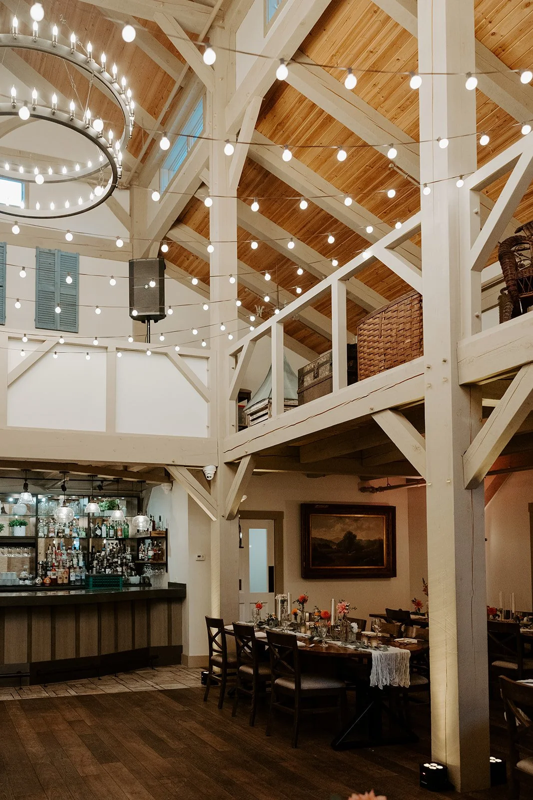 An indoor wedding reception in a barn