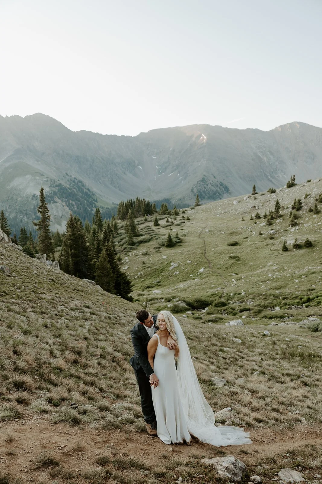 A bride and groom taking Colorado destination wedding photos