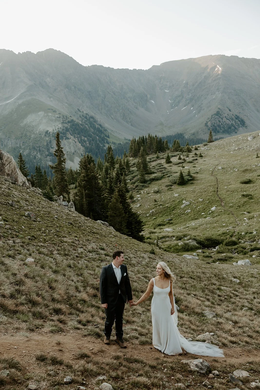 A bride and groom taking Colorado destination wedding photos
