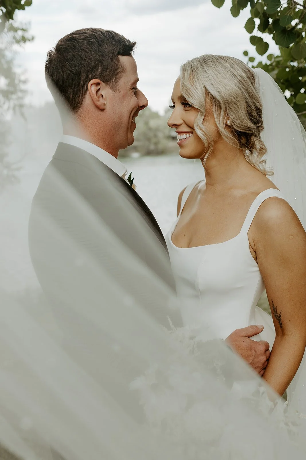A bride and groom posing for wedding photos