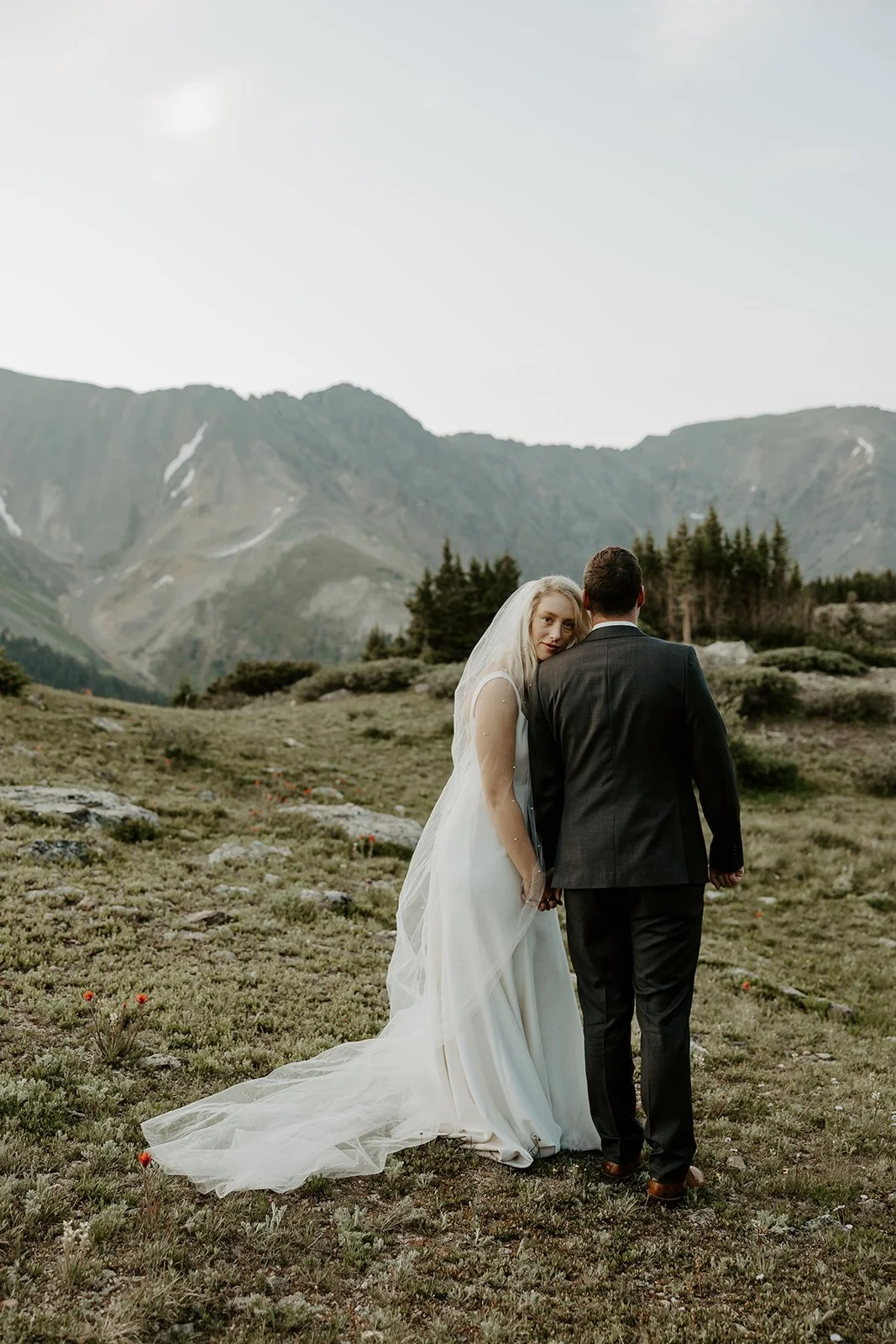 A bride and groom posing for Colorado destination wedding photos