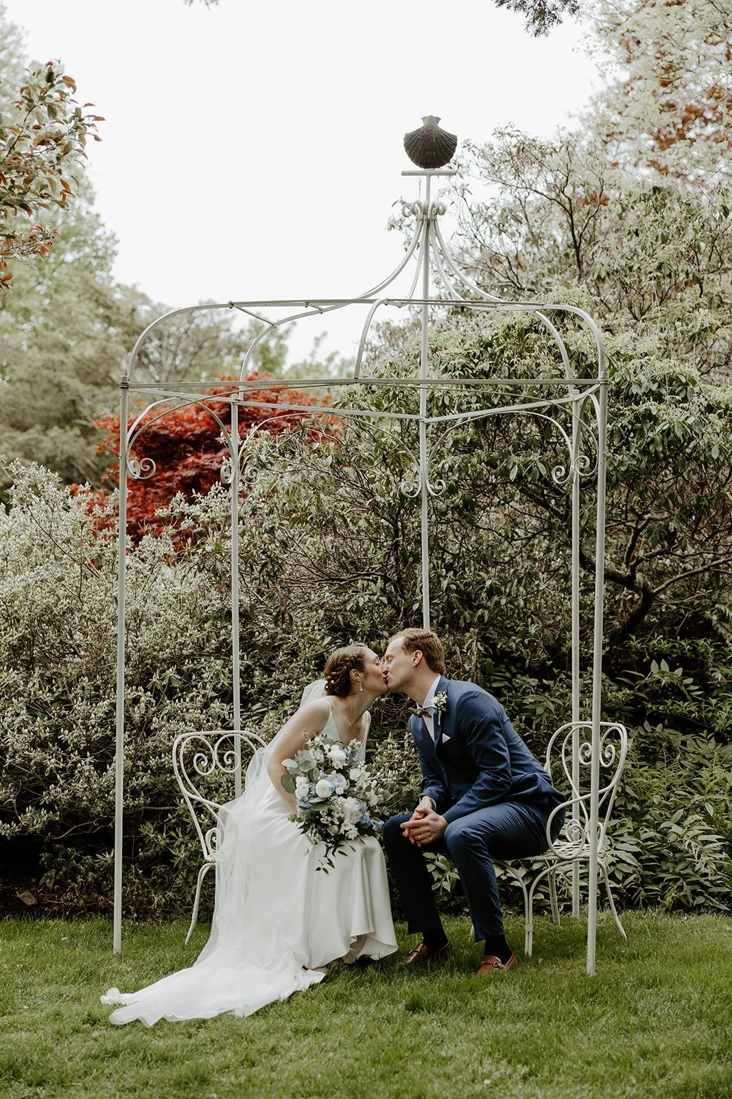 A bride and groom taking spring wedding photos that show why spring is the best time to get married