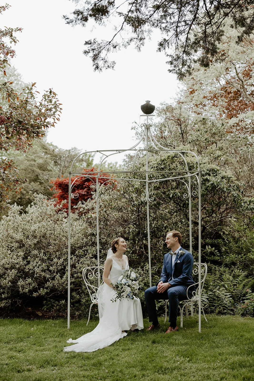 A bride and groom taking spring wedding photos that show why spring is the best time to get married