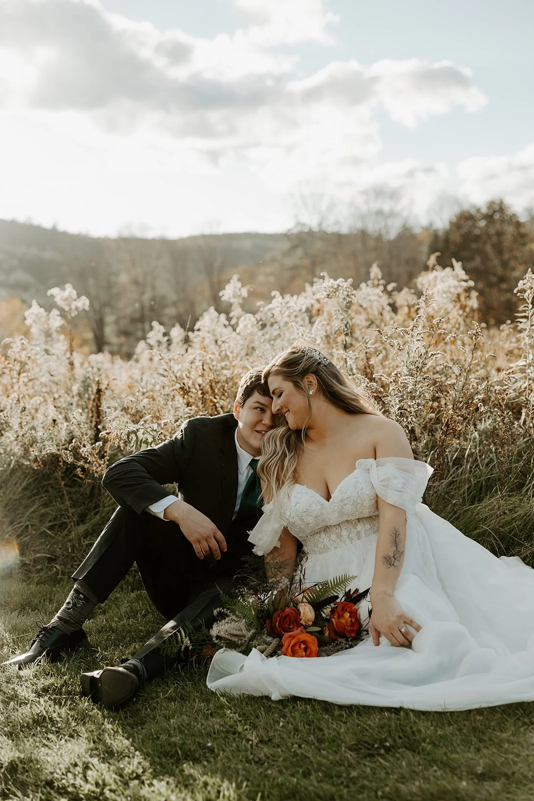 A bride and groom pausing for fall wedding photos