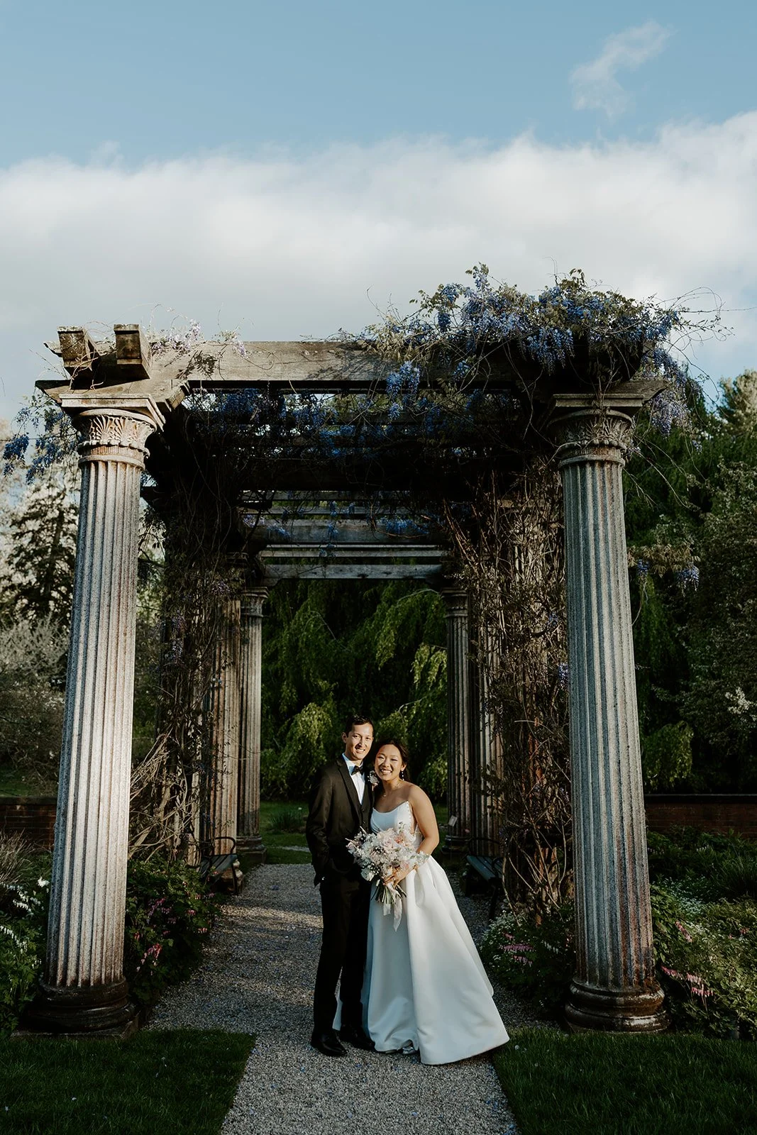 A bride and groom posing for portraits at Glen Magna Farms