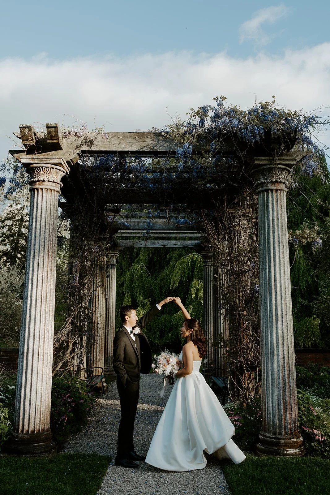 A bride and groom posing for portraits at Glen Magna Farms