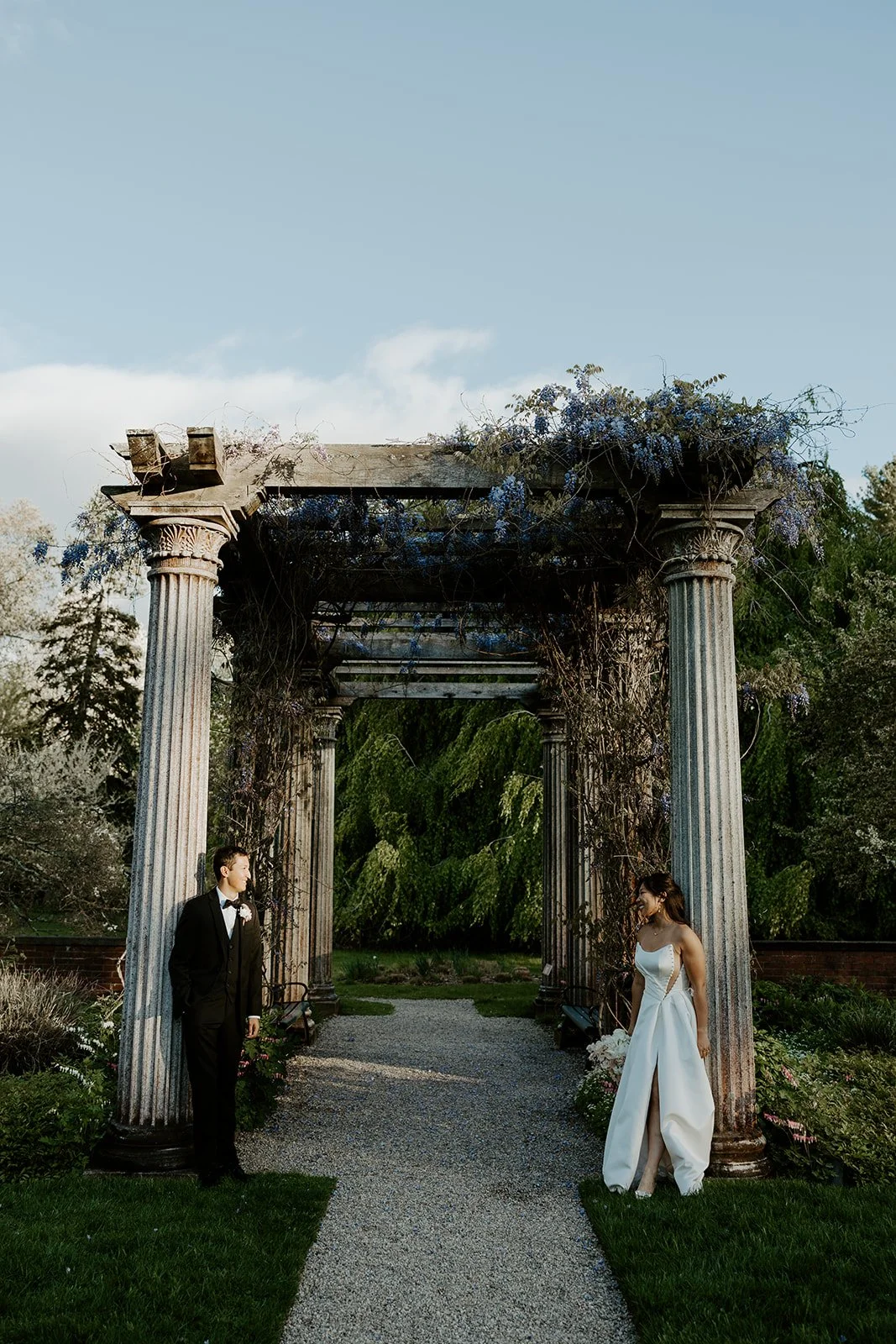 A bride and groom posing for portraits at Glen Magna Farms