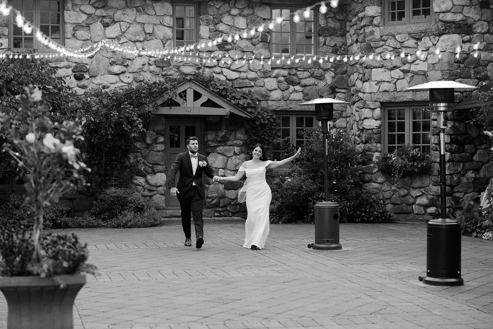 A bride and groom entering their estate wedding venue reception