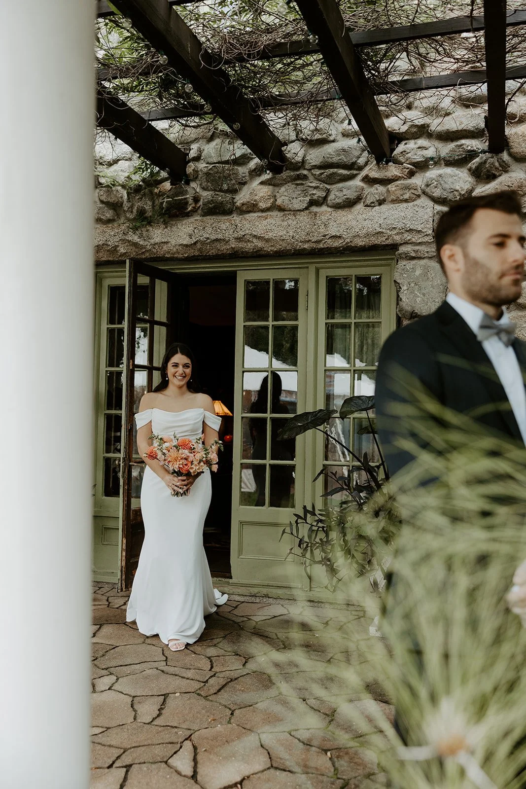 A bride walking out of Willowdale Estate for a first look