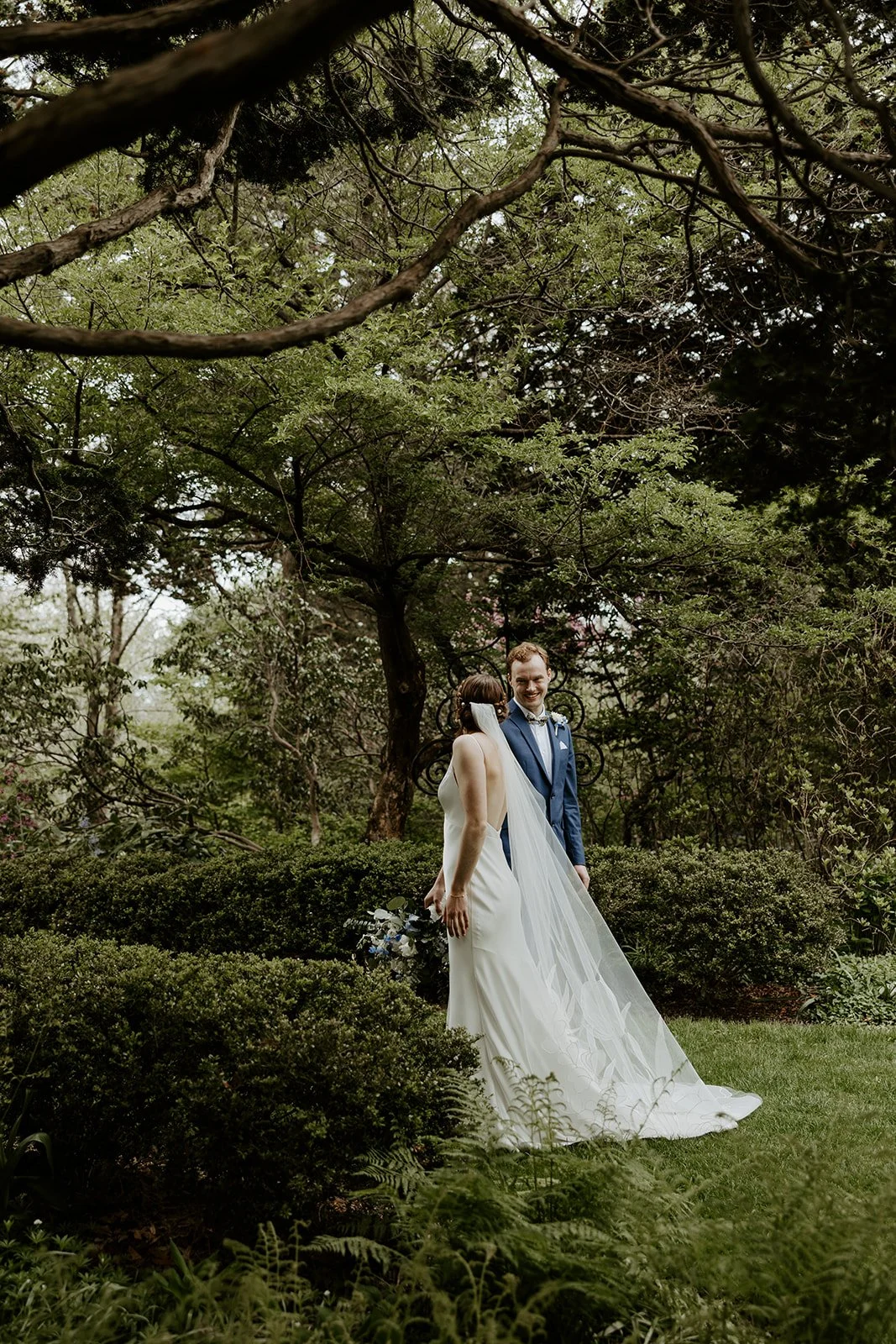 A bride and groom kissing at their estate wedding venue