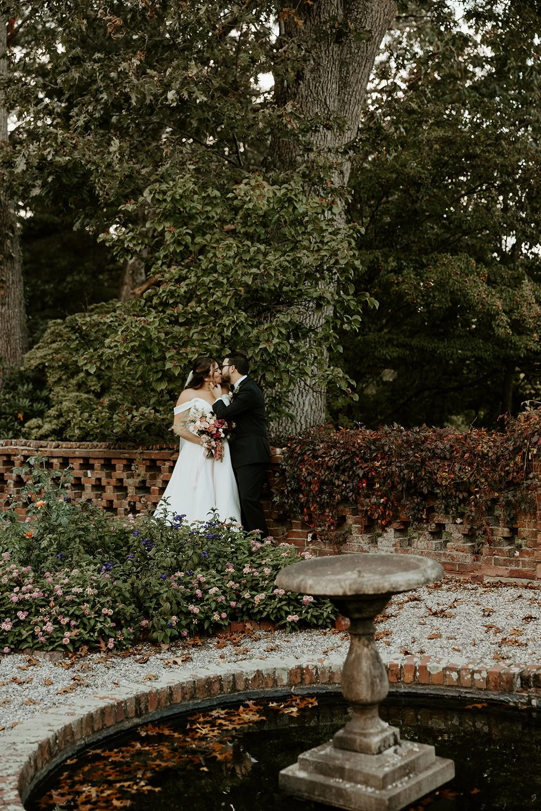 A bride and groom in the gardens at Bradley Estate