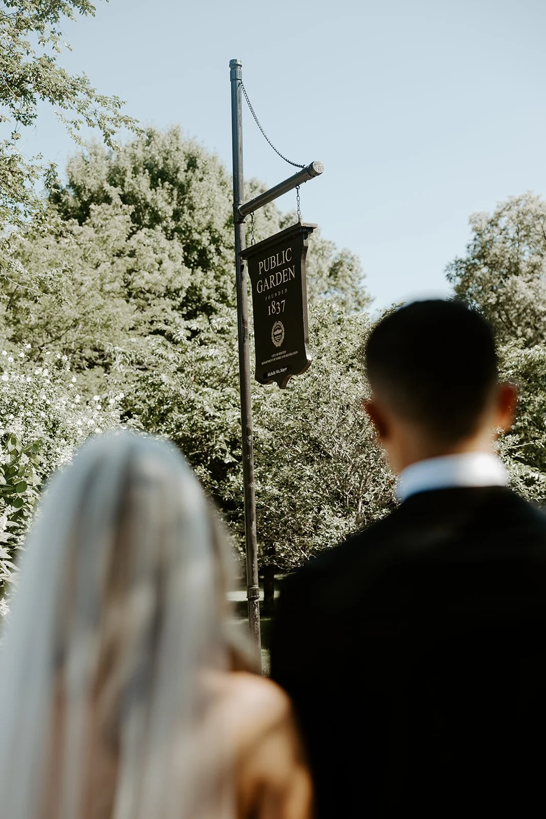 A bride and groom outside of Boston Public Garden for their wedding