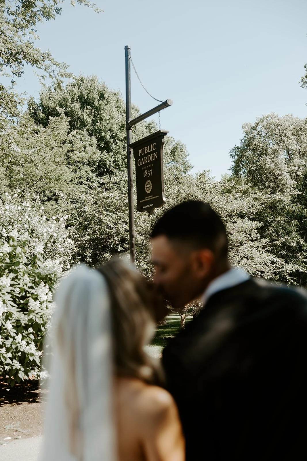 A bride and groom outside of Boston Public Garden for their wedding