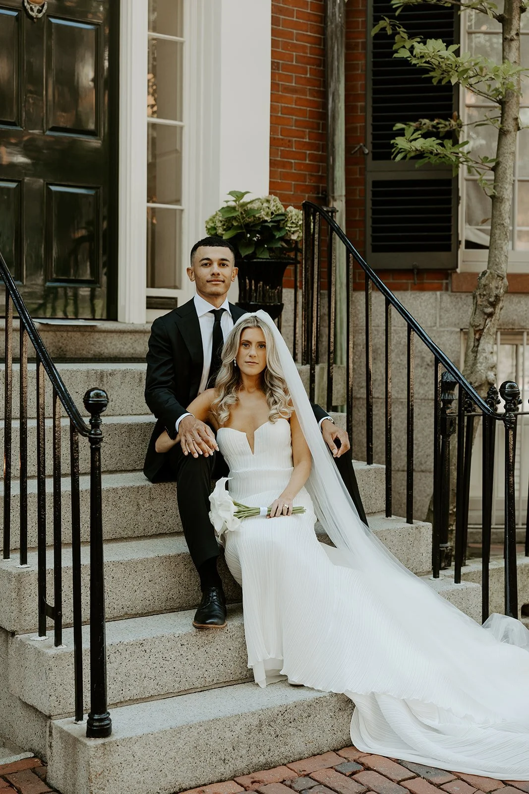 A bride and groom taking wedding photos in Beacon Hill