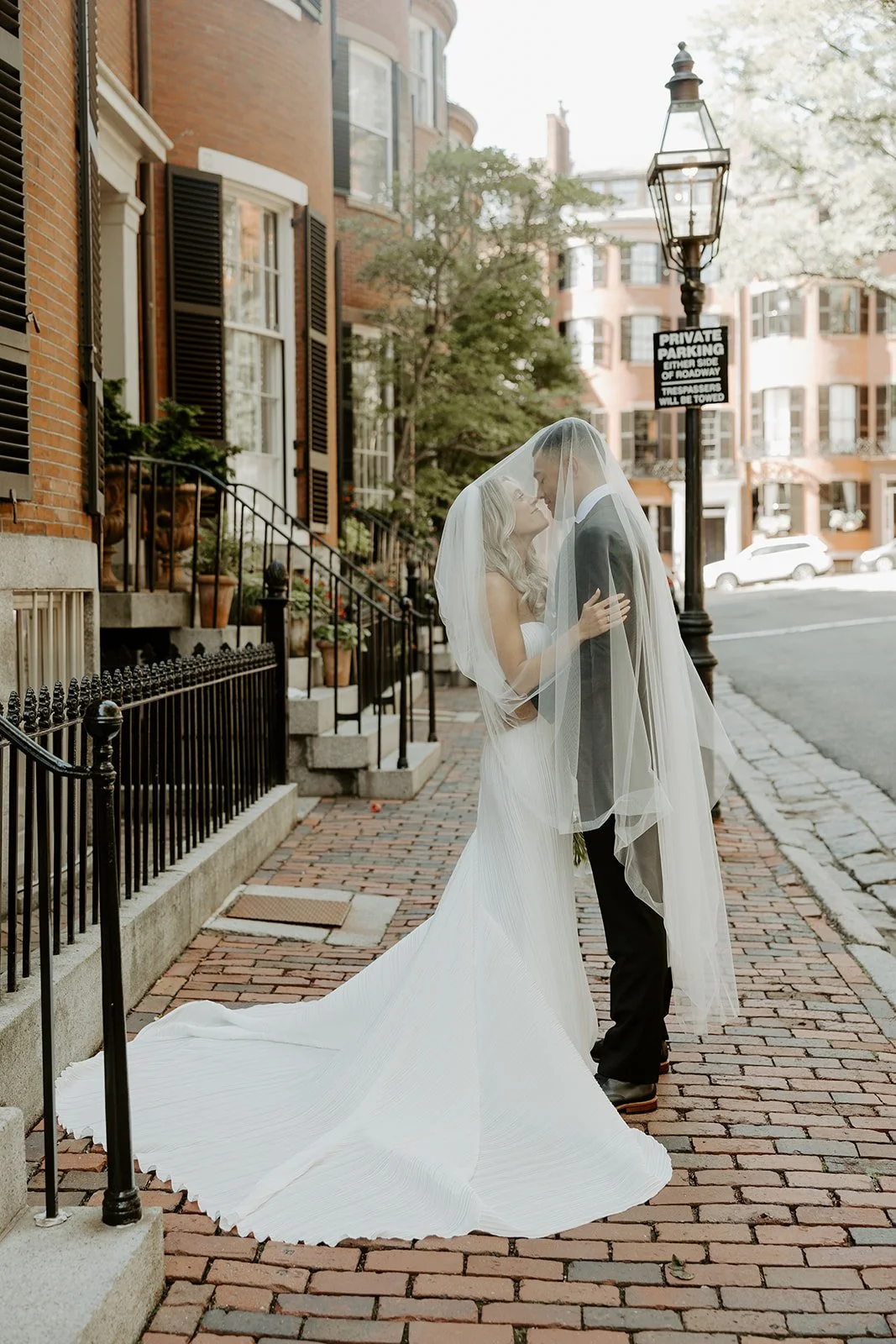 A bride and groom taking wedding photos in Beacon Hill