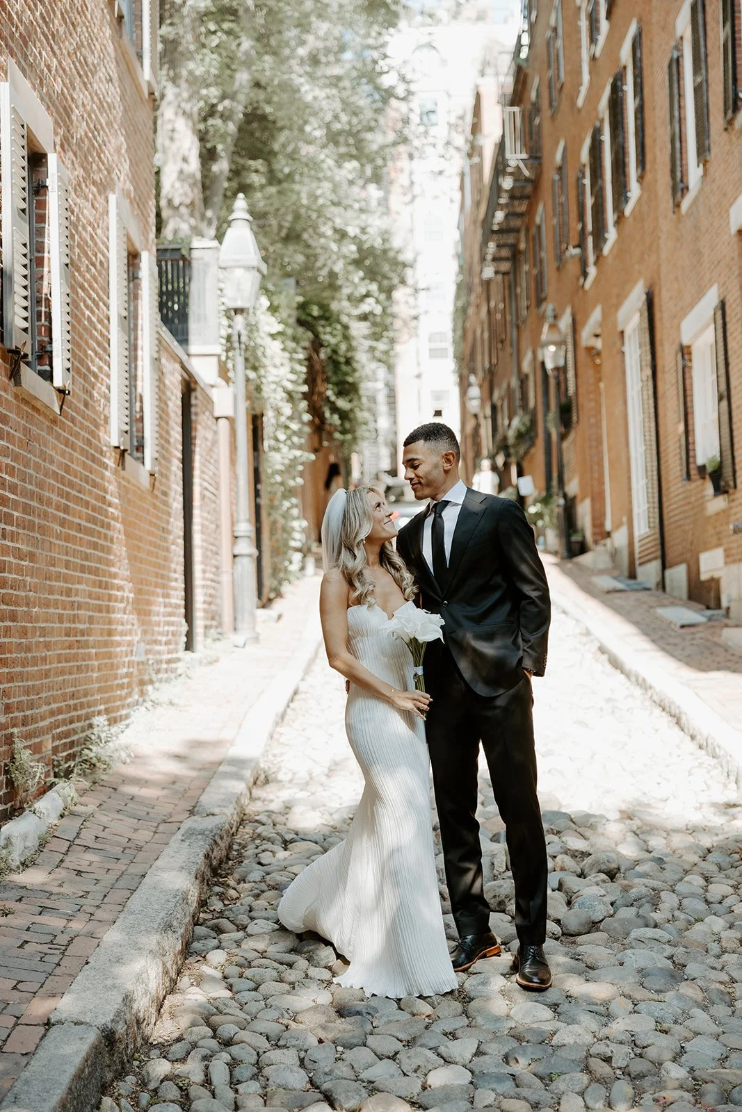 A bride and groom taking wedding photos in Beacon Hill