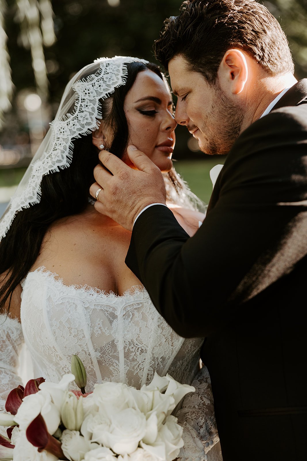 A bride and groom posing for Boston Public Garden wedding photos