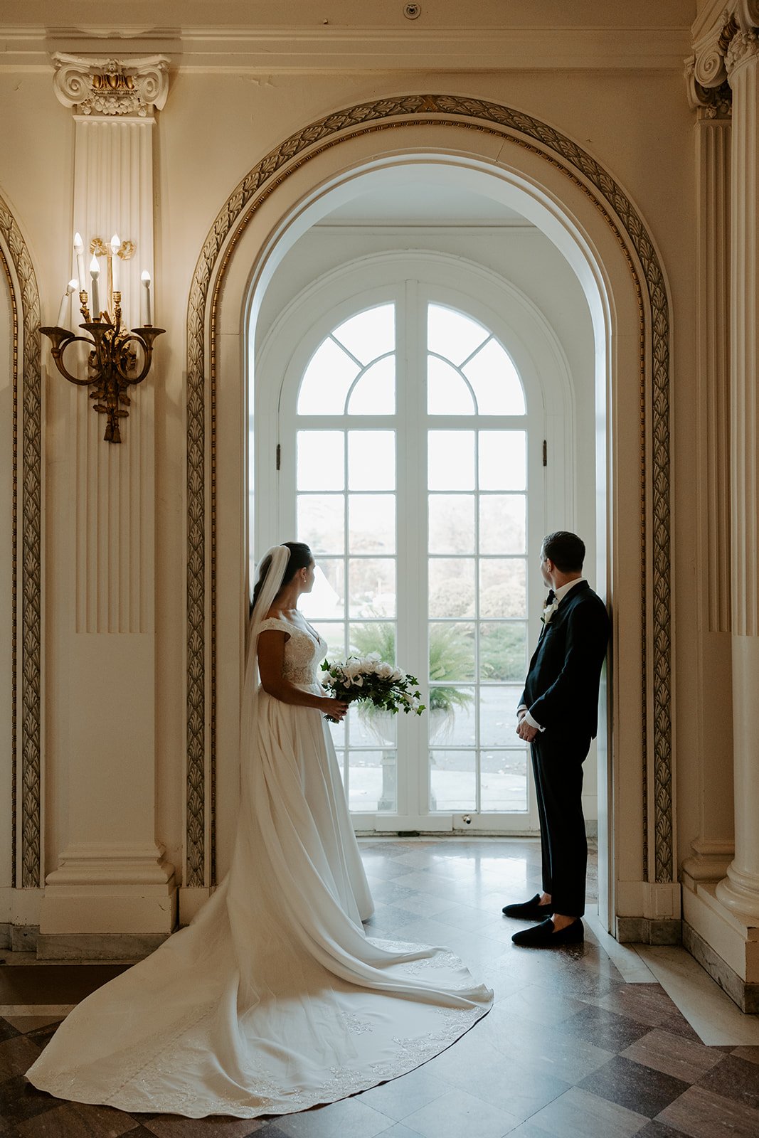 A bride and groom in an estate as their wedding setting
