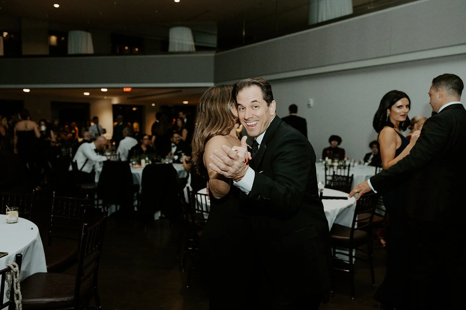Wedding guests dancing at a city wedding