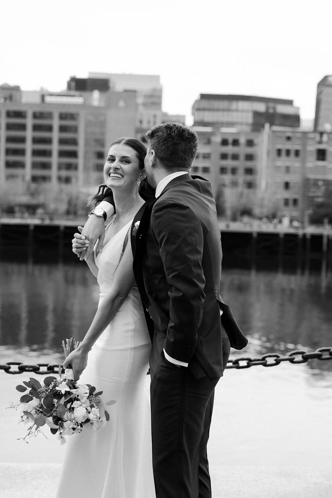 A bride and groom in a city wedding setting for portraits
