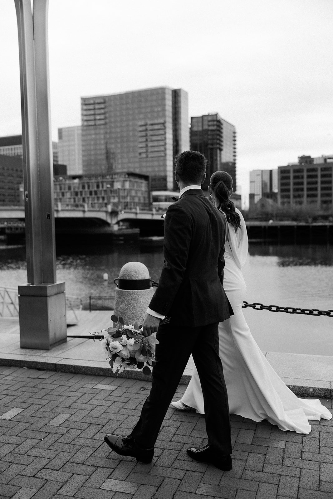 A bride and groom in a city wedding setting for portraits