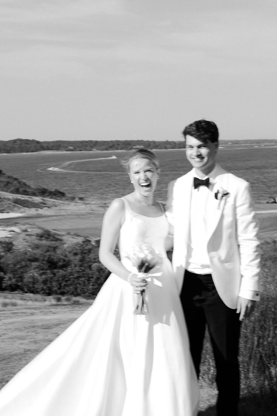 A bride and groom in blurry coastal wedding photos