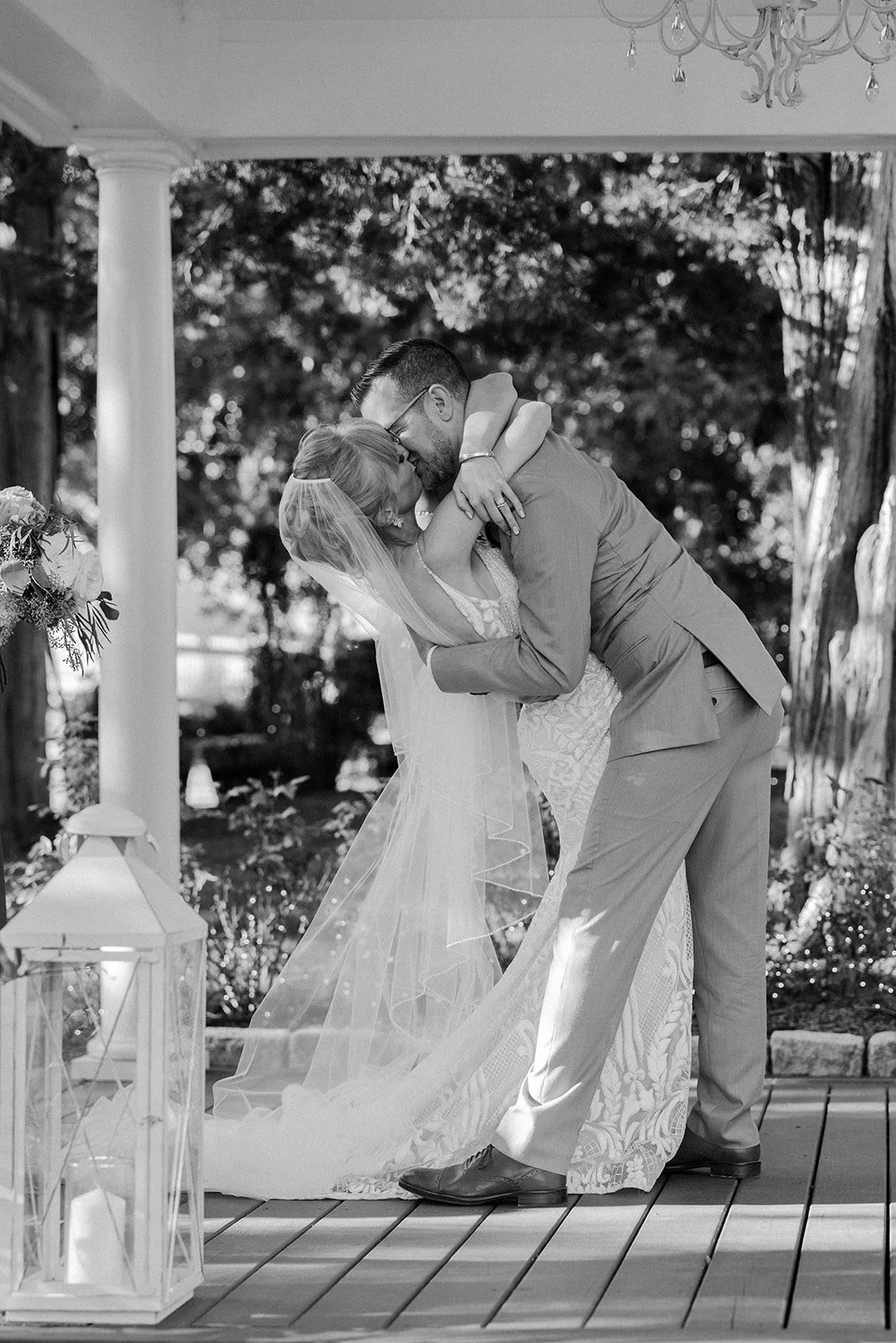 A bride and groom kissing at their wedding ceremony
