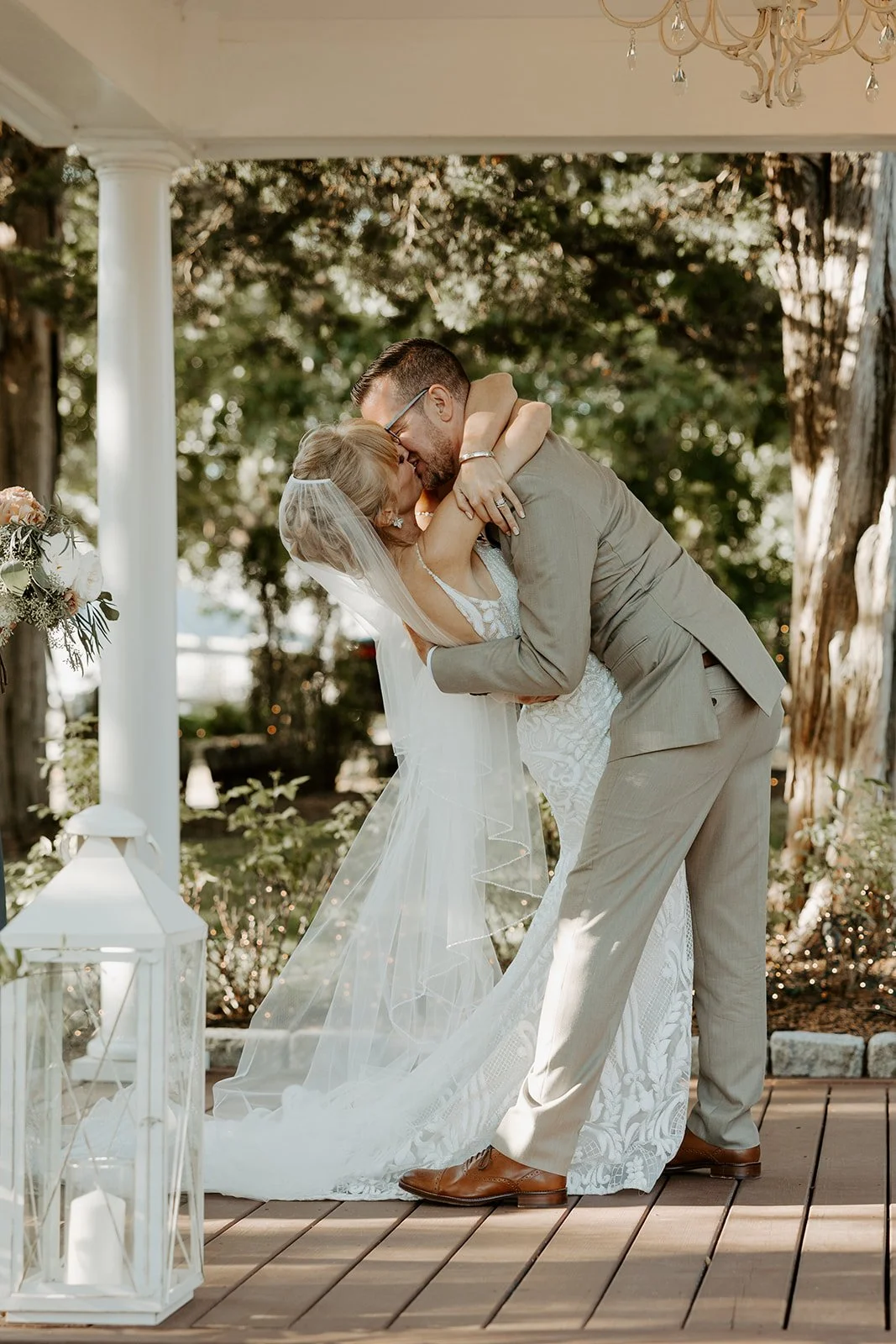A bride and groom kissing at their wedding ceremony