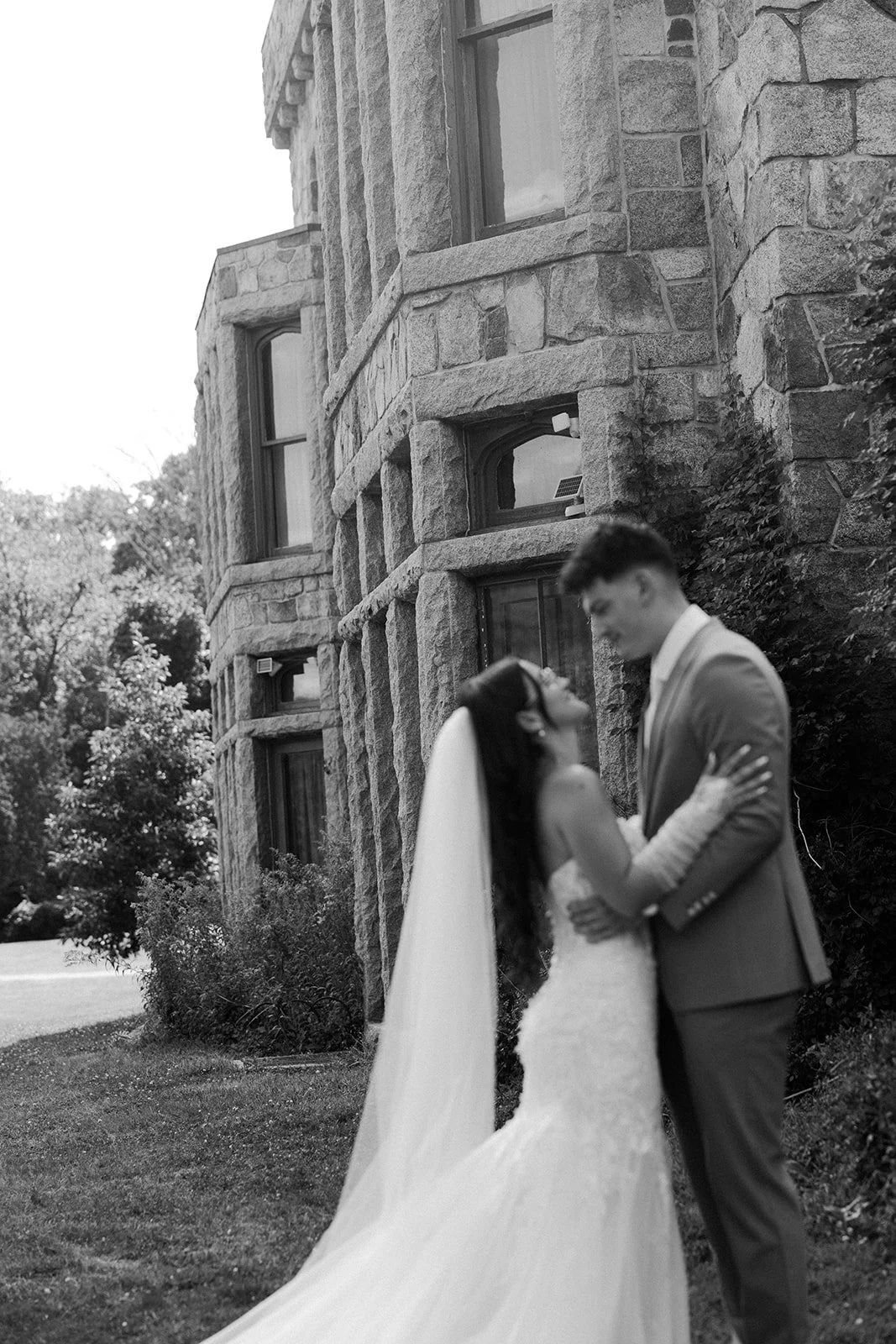 A black and white photo of a bride and groom