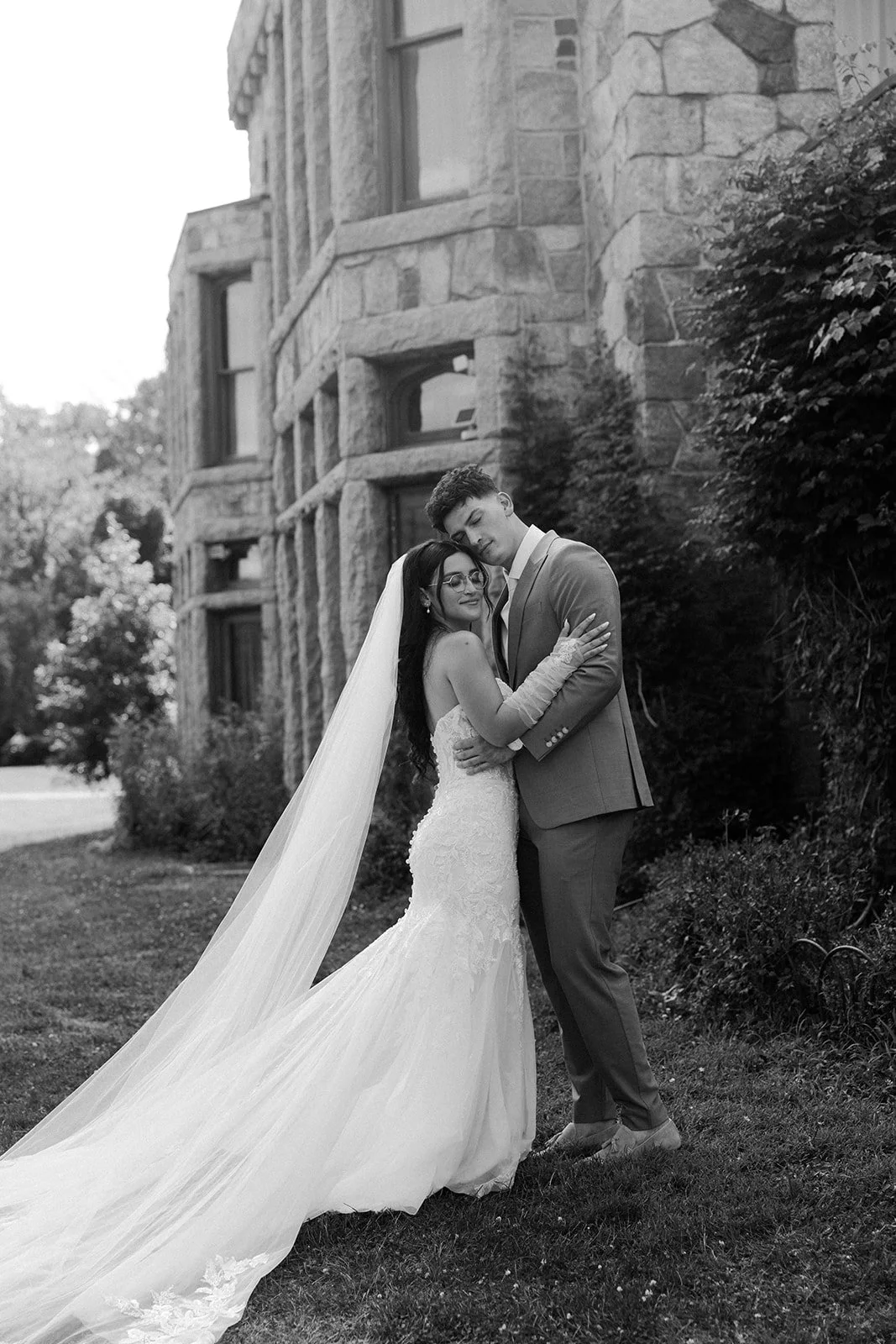 A black and white photo of a bride and groom
