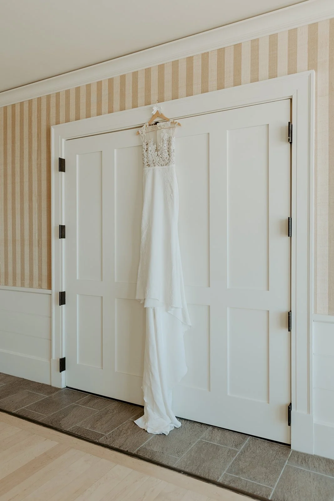 A wedding dress hanging up before a Beauport Hotel wedding