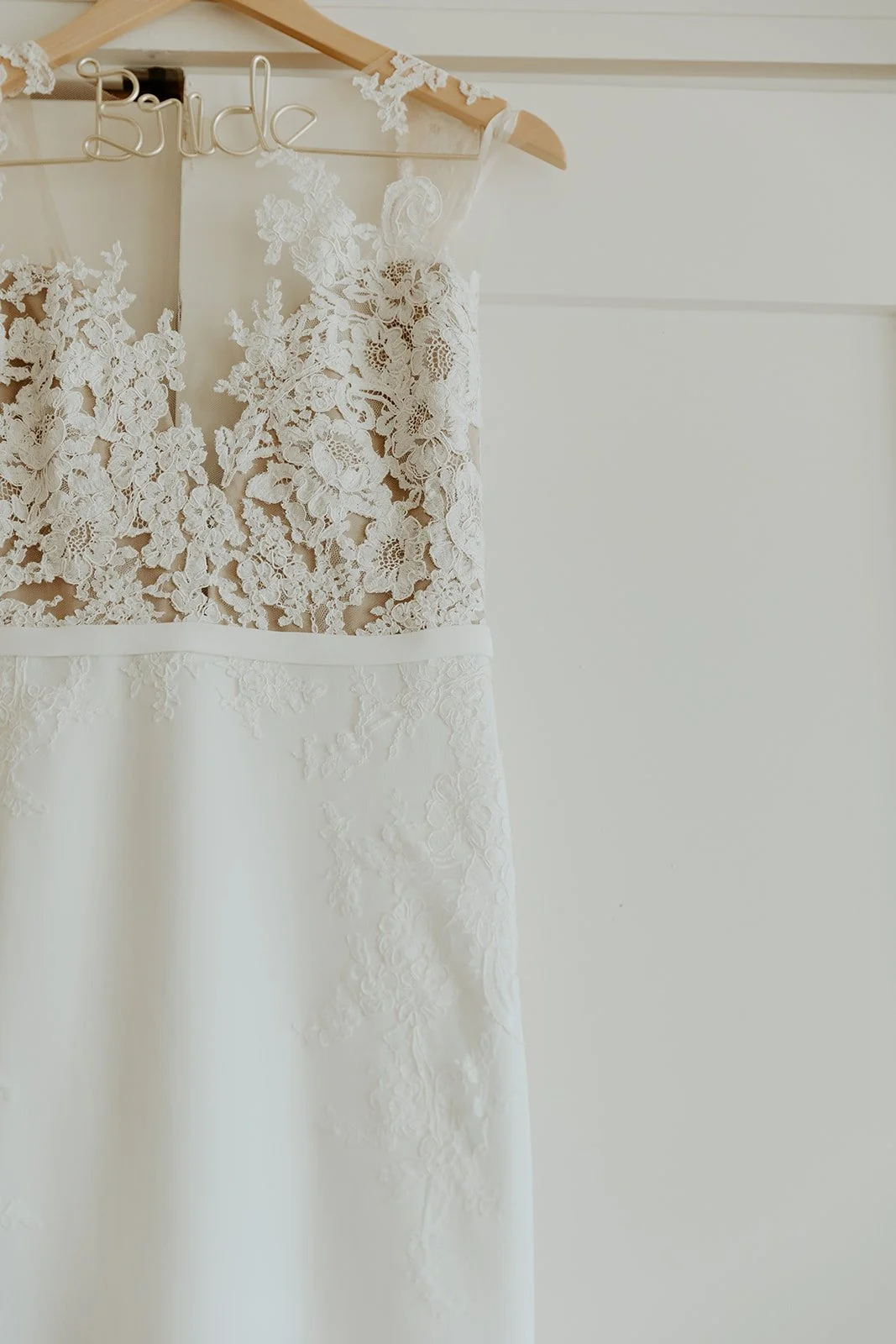 A wedding dress hanging up before a Beauport Hotel wedding
