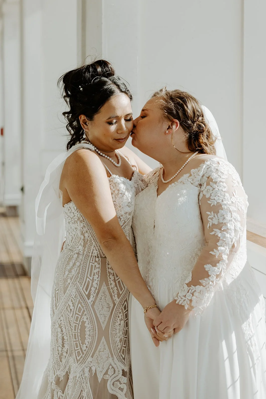 Two brides taking wedding photos