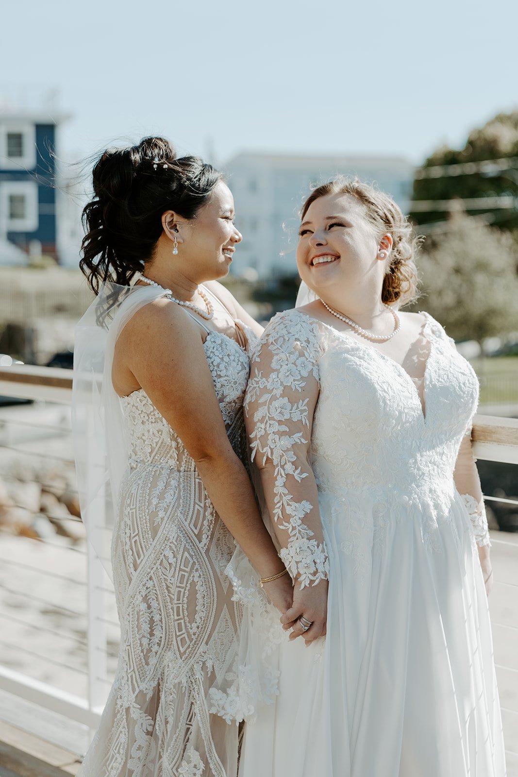 Two brides taking wedding photos