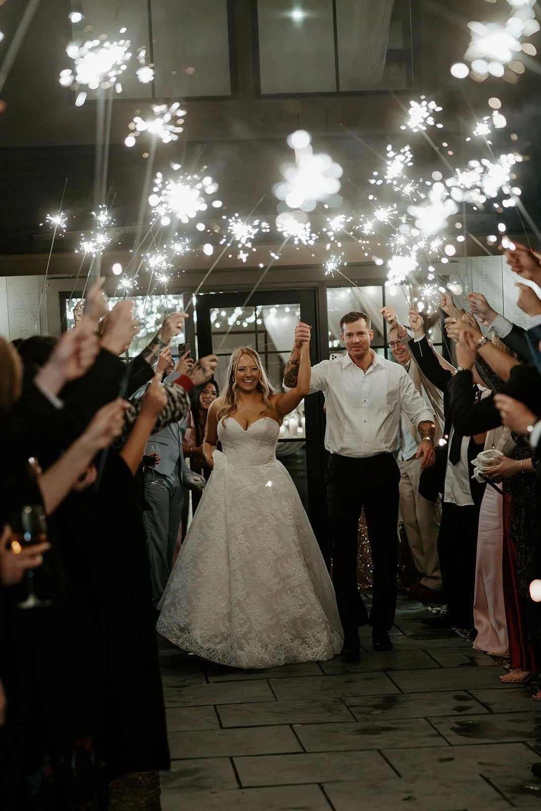 A bride and groom during a sparkler sendoff