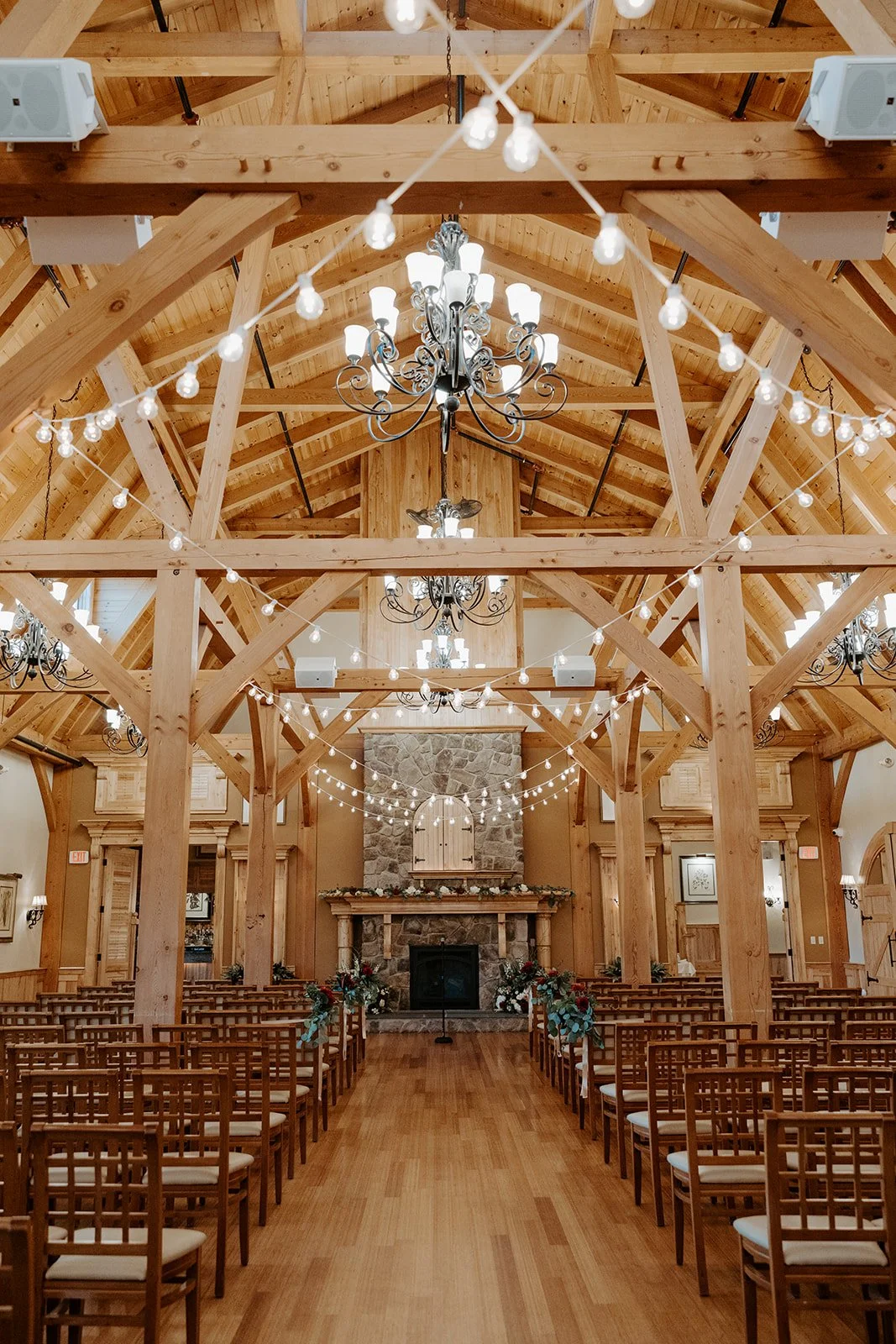 A wedding ceremony inside of the Red Barn at Outlook Farm