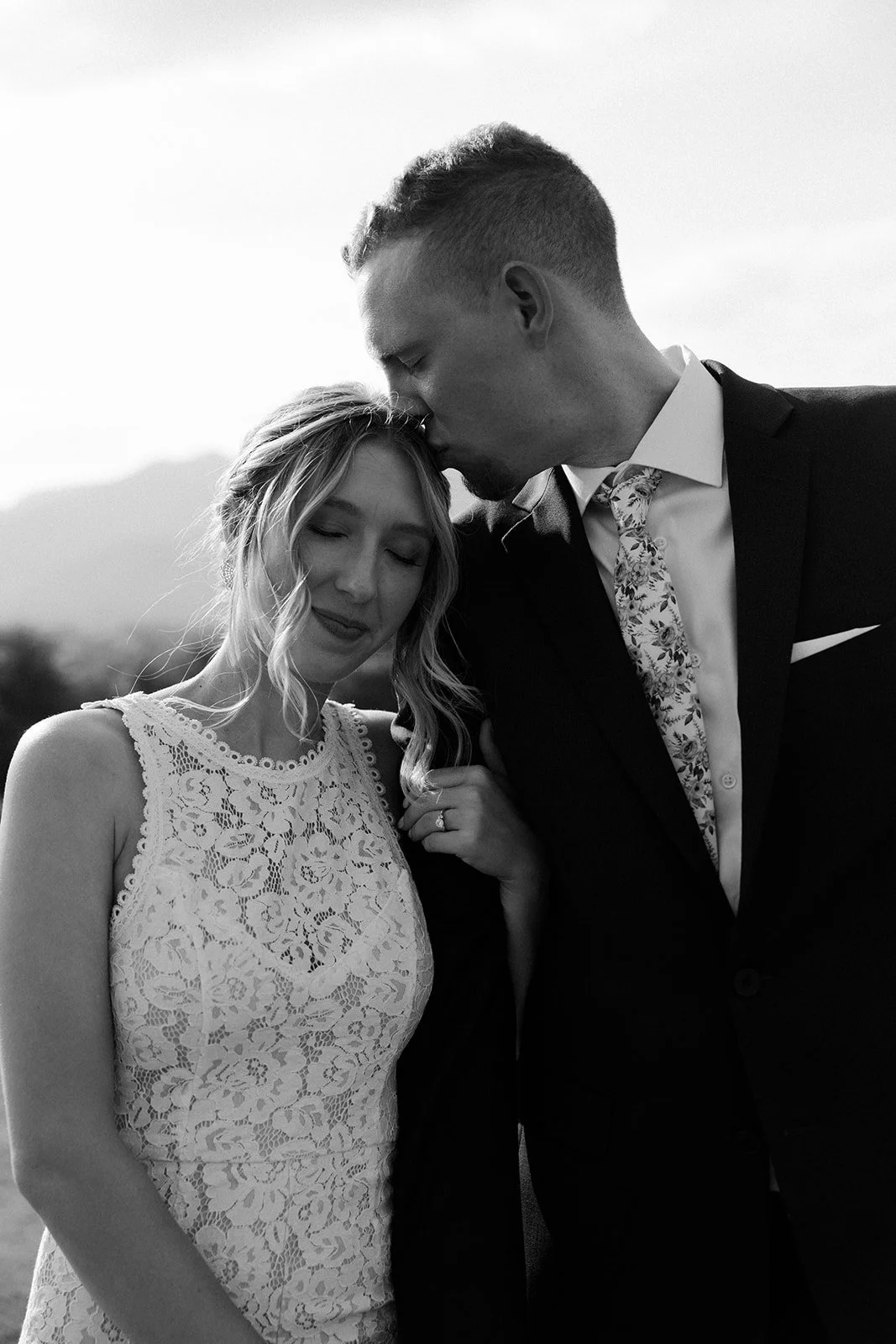 A bride and groom posing for wedding photos