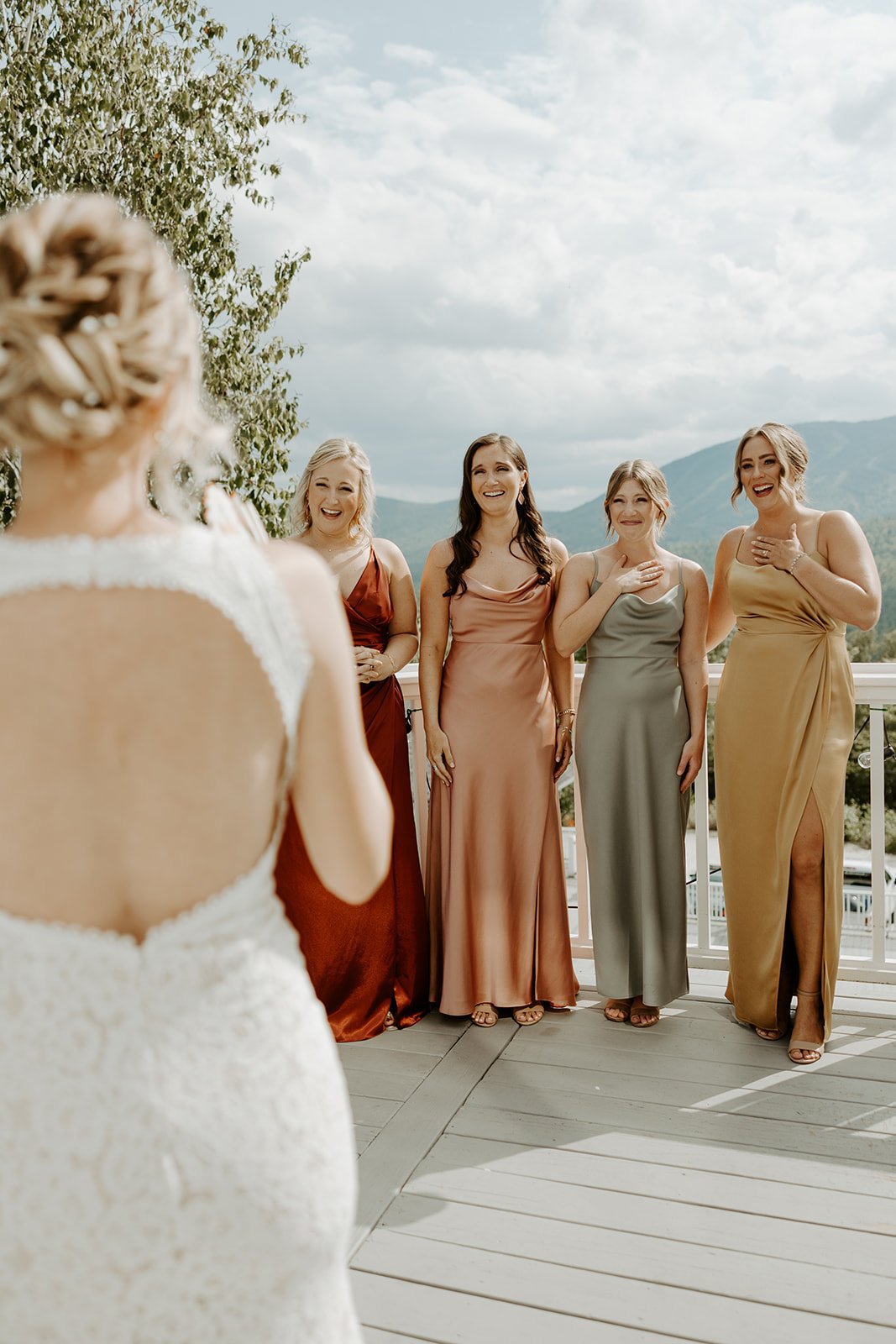 A bride doing a first look with  her bridesmaids